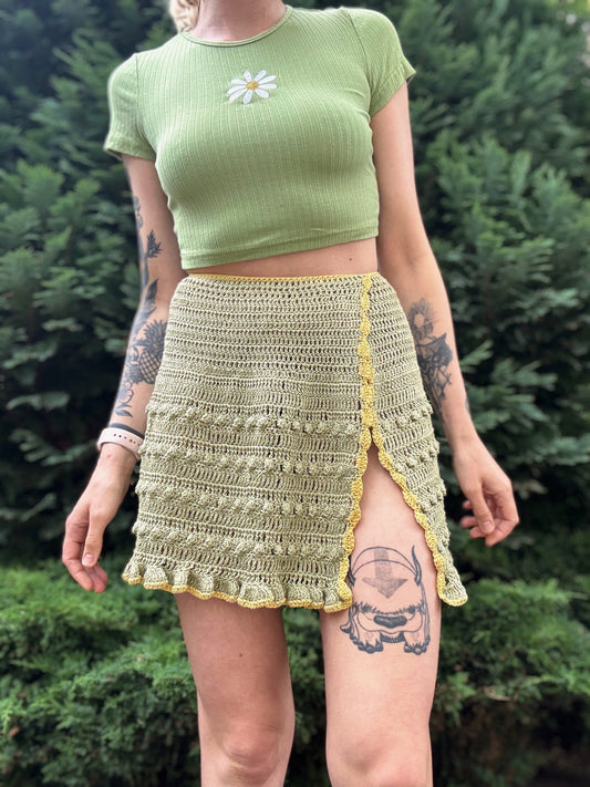 Beginner friendly, customizable wrap skirt crochet pattern, perfect for summer fashion in green color from the front.