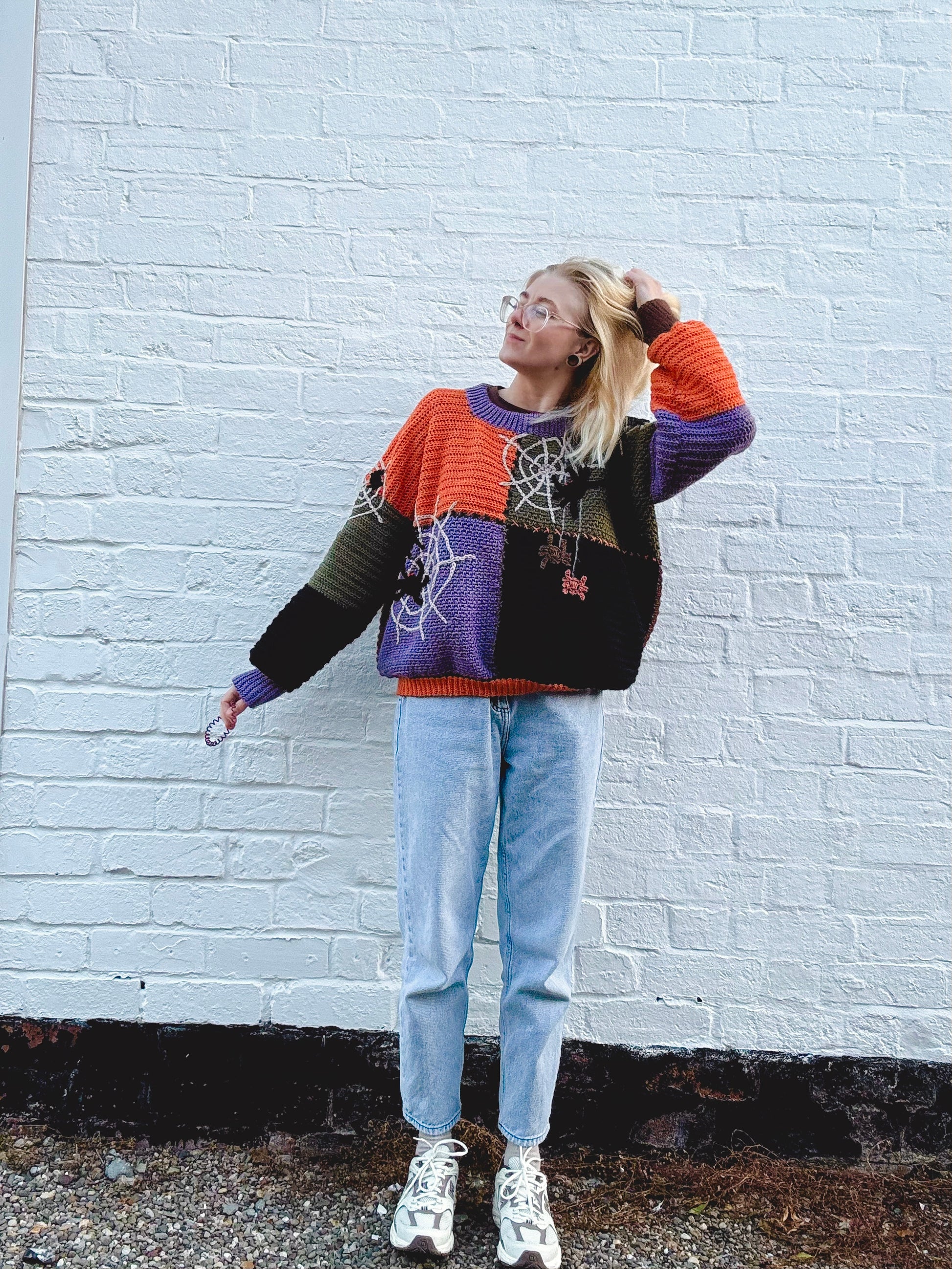 Beginners friendly patchwork sweater crochet pattern. Spider web design. Cozy fall Halloween outfit idea made in orange, brown, purple and black colors. Customizable in size and colors crochet pattern.