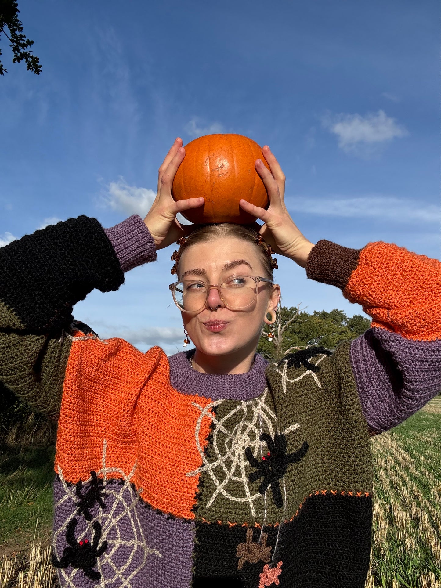 Beginners Friendly oversized sweater with autumn details crochet pattern. Made-to-measure, customizable in size and color. Cozy fit for autumn walks and pumpkin patch days. Sweater in green, brown, orange, purple colors.
