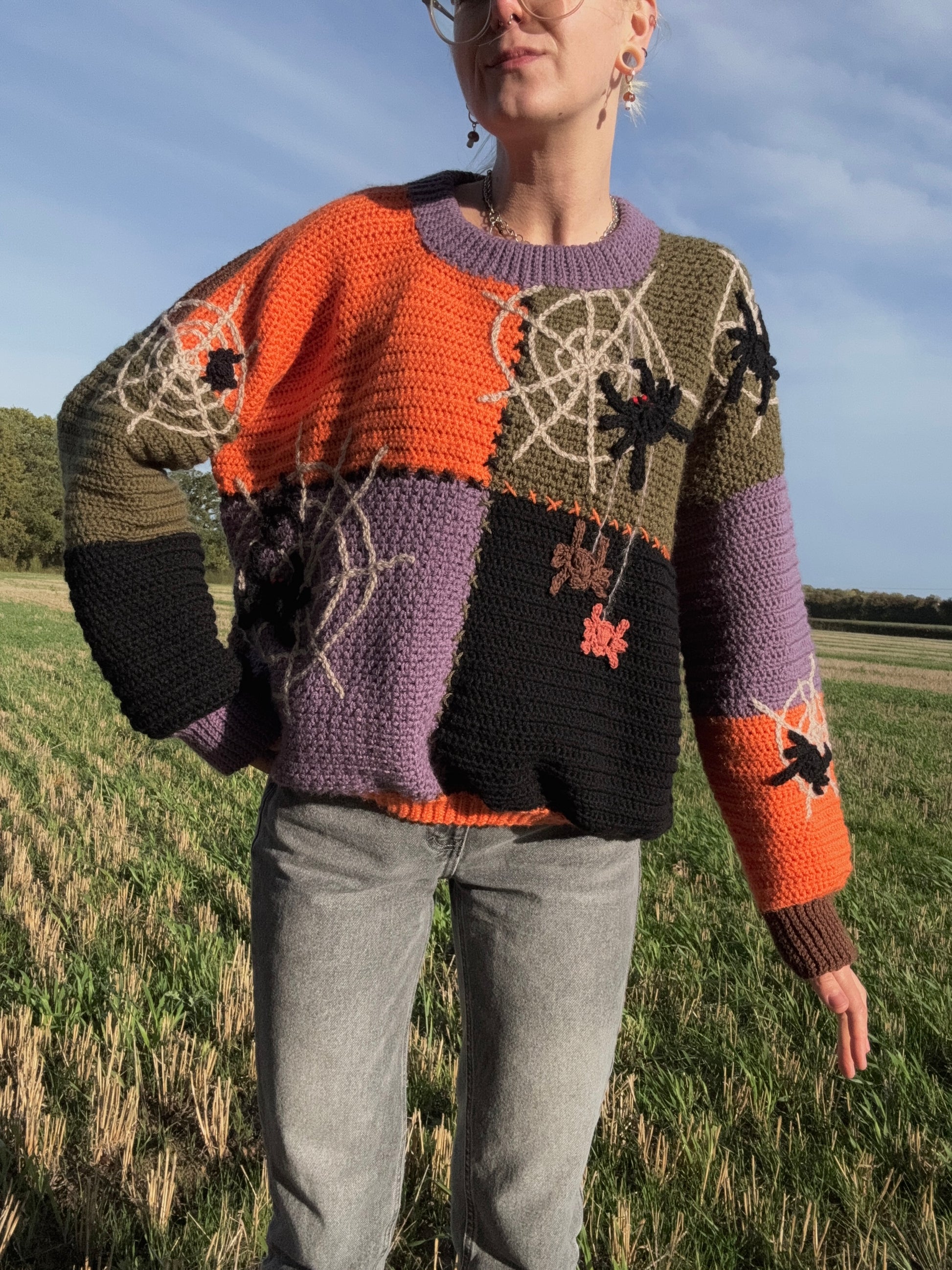 Beginners Friendly Autumn oversized sweater crochet pattern with step-by-step photo tutorials. Crochet pattern customizable in size and color. Cozy fit for Halloween parties in green, brown, orange, purple colors.