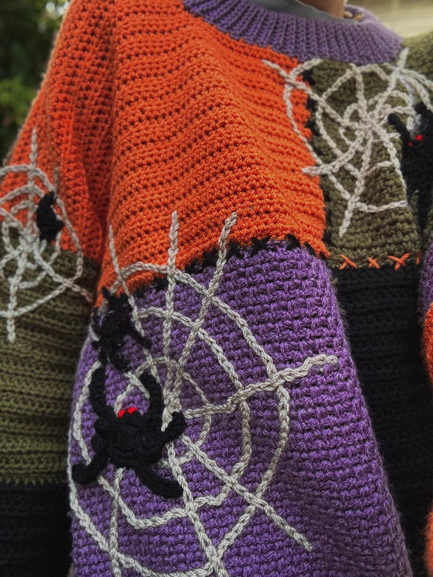 Beginners friendly crochet pattern for relaxed fit sweater with Halloween details, spider web applique, spider applique, mushroom applique, styled for trendy 2025 fall outfits.