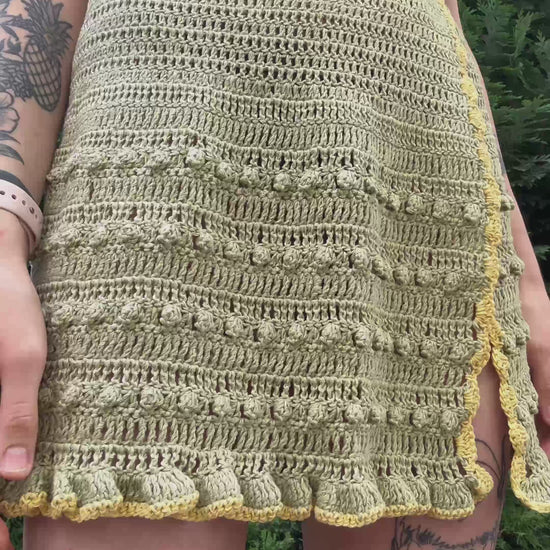 Boho-style crochet skirt pattern with tie waist for beachwear in green color, beginner friendly, customizable crochet pattern.