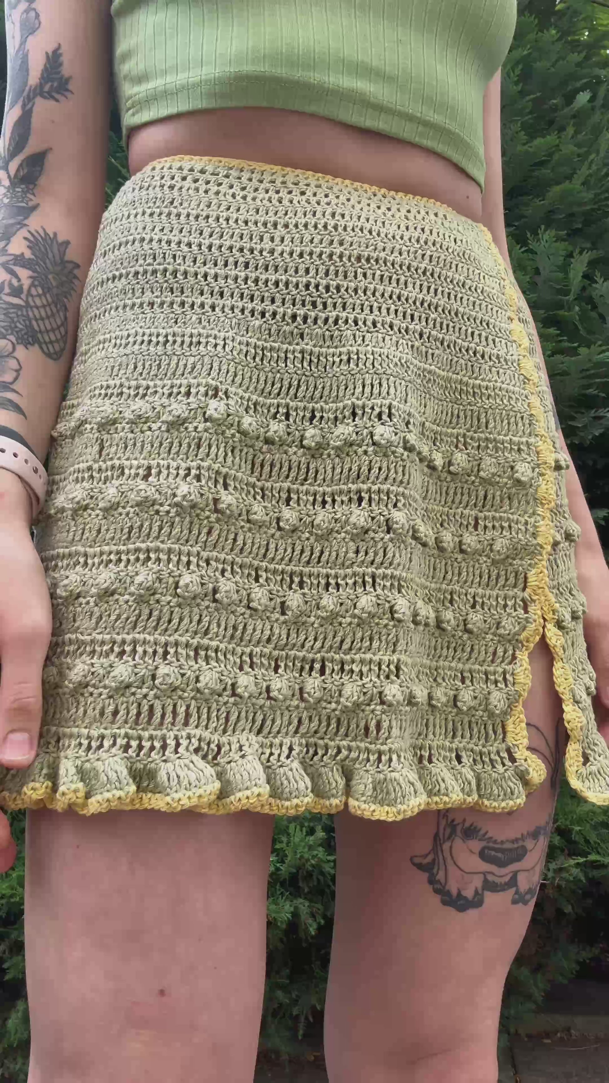 Boho-style crochet skirt pattern with tie waist for beachwear in green color, beginner friendly, customizable crochet pattern.