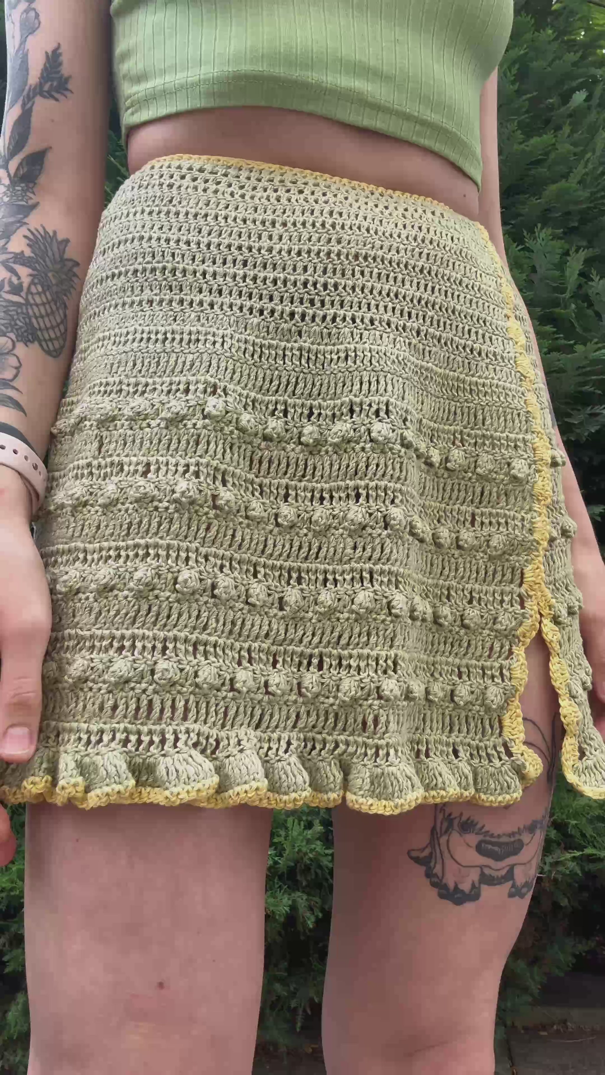Boho-style crochet skirt pattern with tie waist for beachwear in green color, beginner friendly, customizable crochet pattern.